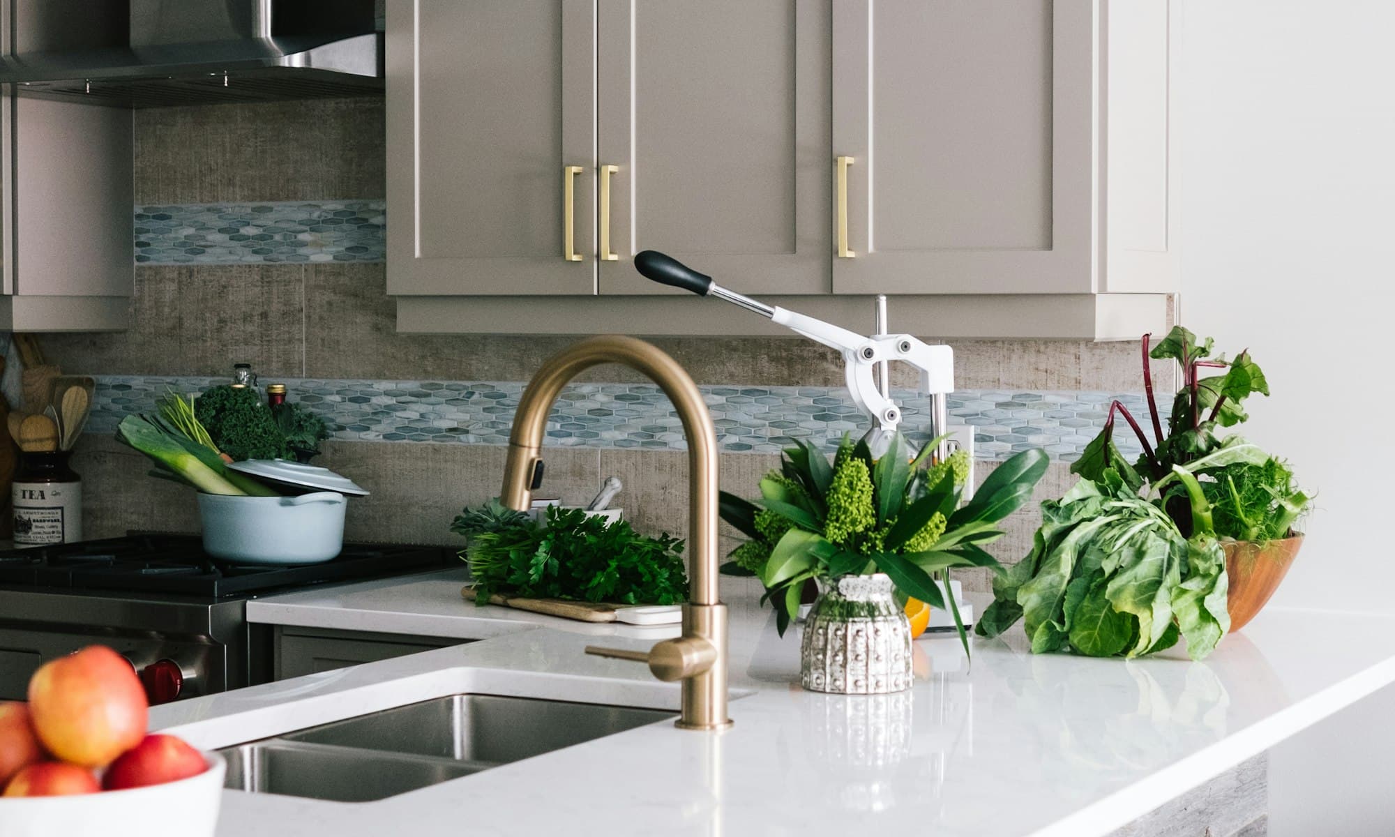 A contemporary Australian kitchen with warm timber, stone, and chrome details